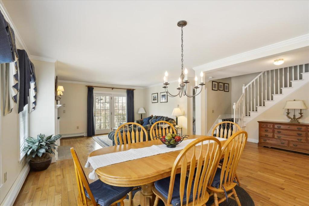 a dining room with a table and chairs at Northern Lights in Stowe