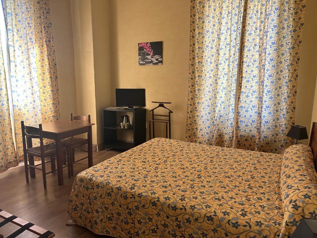 Postel nebo postele na pokoji v ubytování Le Parc aux Cedres