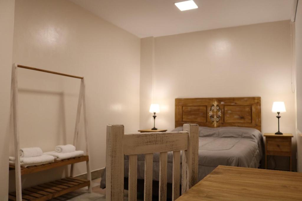 Postel nebo postele na pokoji v ubytování Hotel Quebrachales