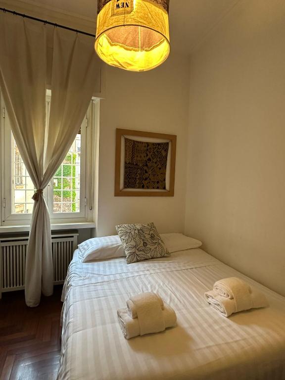 A bed or beds in a room at Porta Latina Apartment