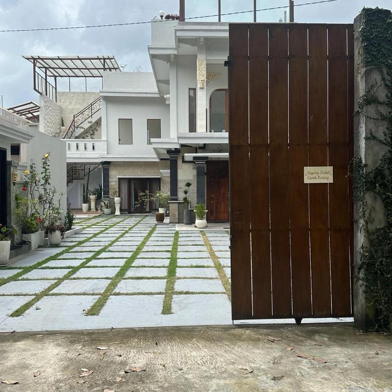 an open door in front of a house at Villa Sayong Indah bedugul in Bedugul