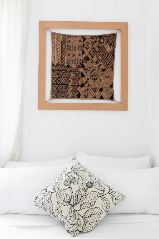 A bed or beds in a room at Porta Latina Apartment