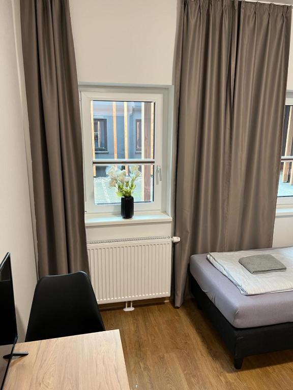 Postel nebo postele na pokoji v ubytování Firstsleep Ebersberg