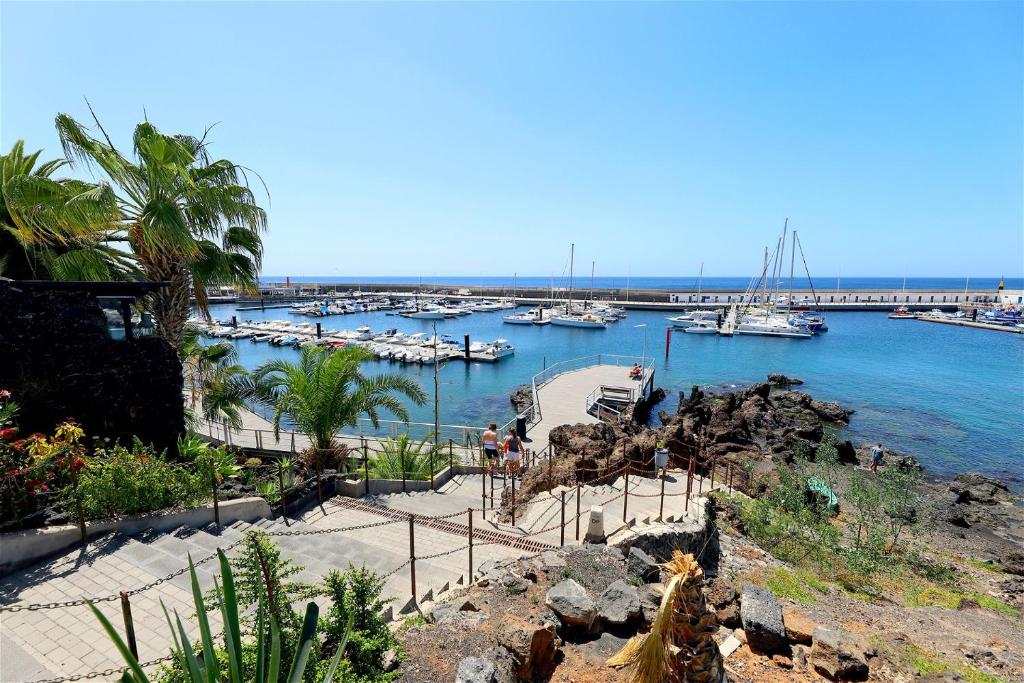 a view of a marina with boats in the water at Buena Pesca 27 in Puerto del Carmen