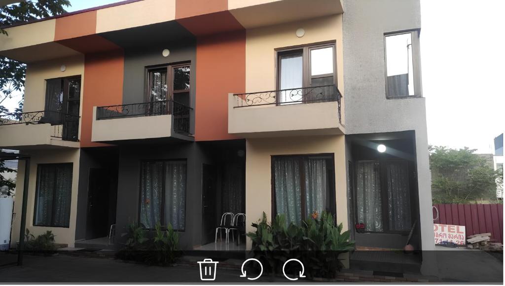 a building with balconies and windows on it at Apart townhouse in K'obulet'i