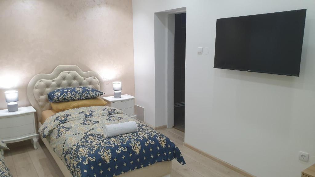 Postel nebo postele na pokoji v ubytování Wellness Villa Mantra Bačka Topola