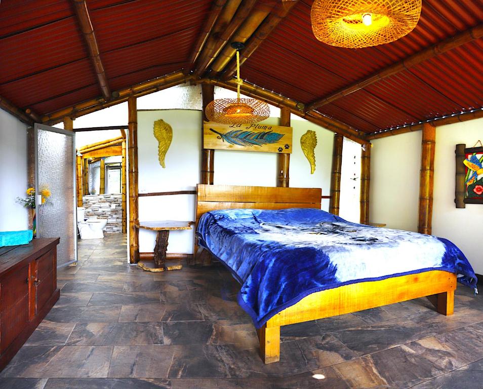 Postel nebo postele na pokoji v ubytování Ecolodge El Puente