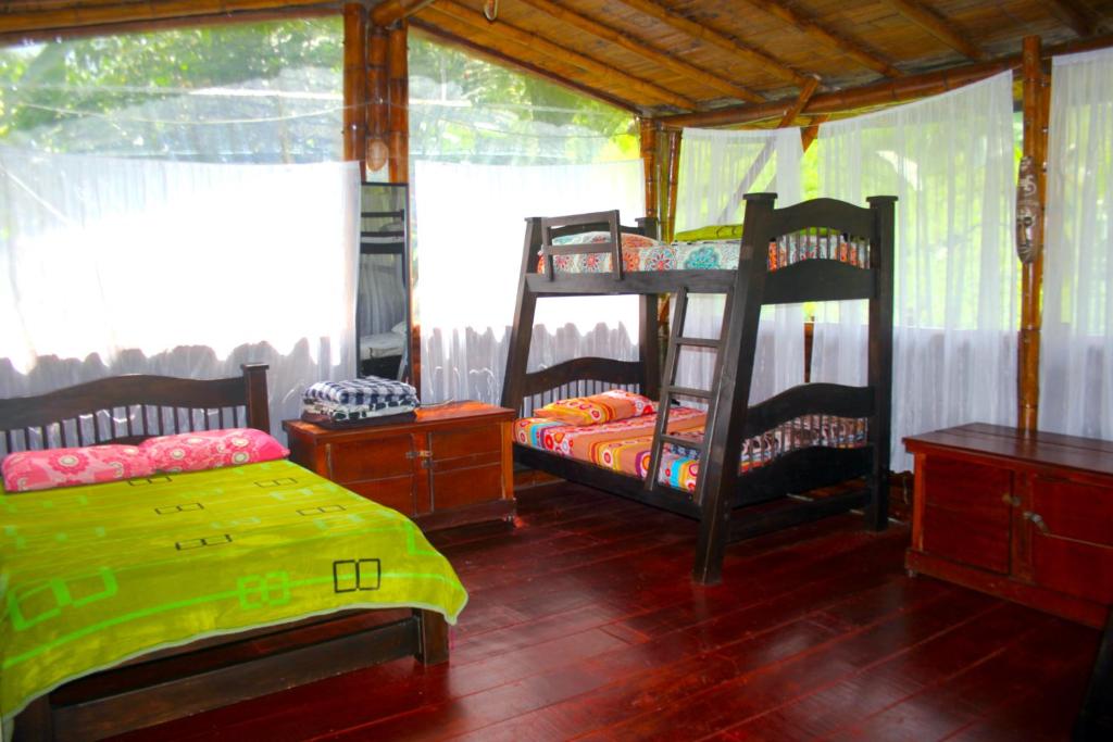 Postel nebo postele na pokoji v ubytování Ecolodge El Puente