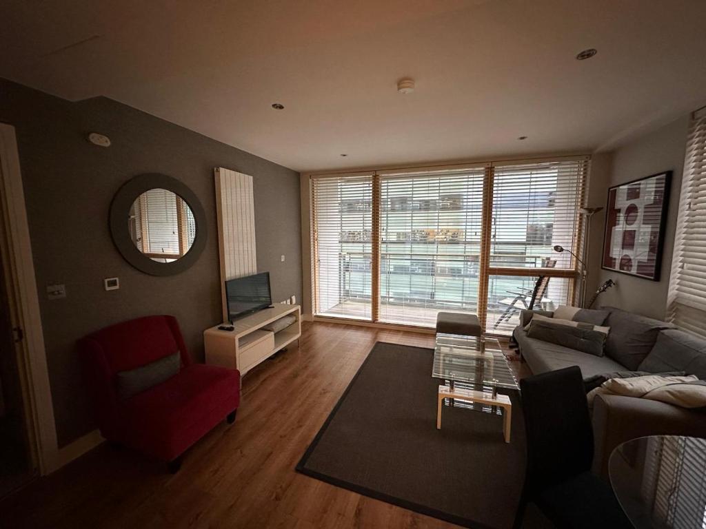 a living room with a couch and a tv at Double Room Homestay in Dublin