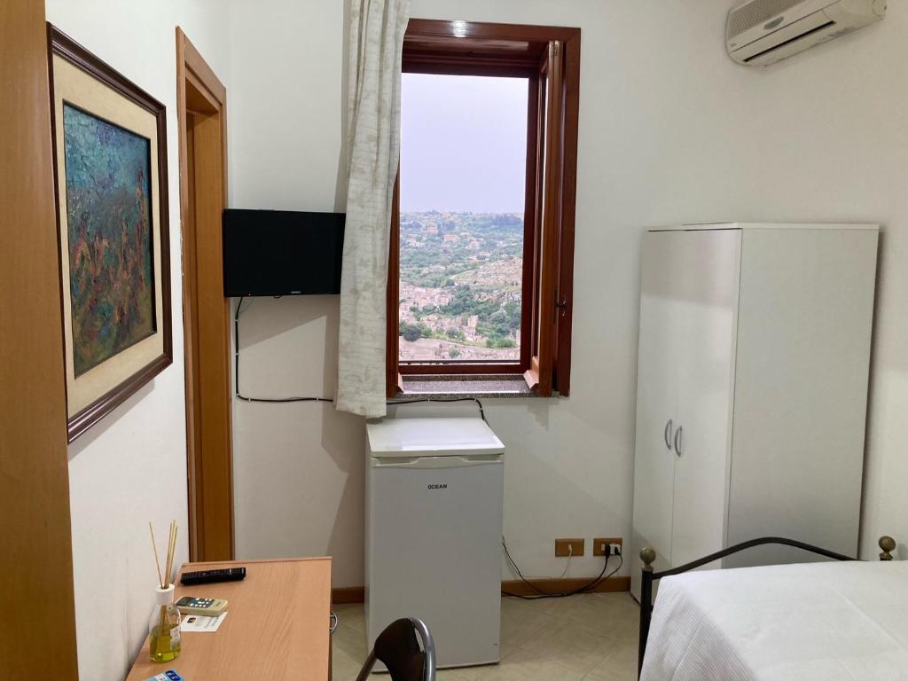 TV a/nebo společenská místnost v ubytování B&B La Terrazza Dell'Itria