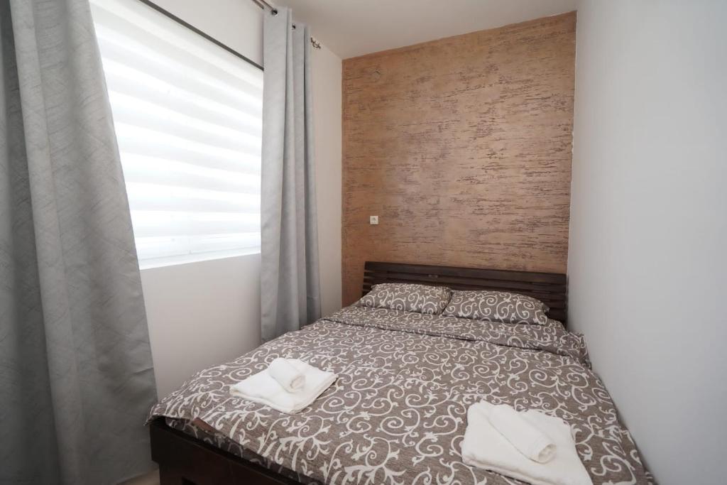 Postel nebo postele na pokoji v ubytování Todor Apartmani