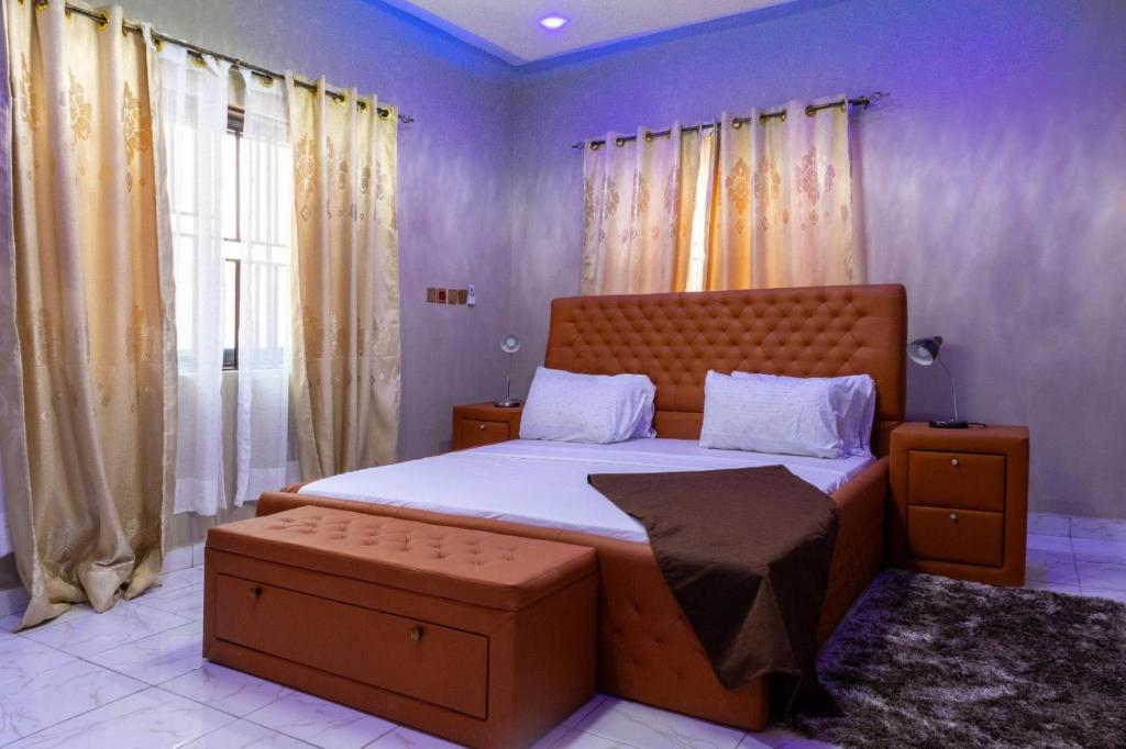 a bedroom with a large bed in a room at THE OPULENT OASIS in Accra