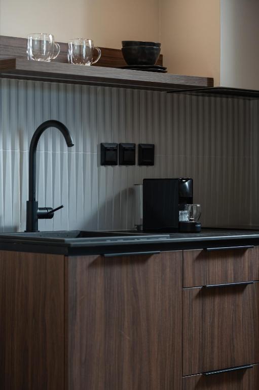 Kuchyň nebo kuchyňský kout v ubytování Olivera Suites Sarti