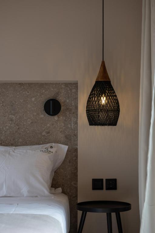 Postel nebo postele na pokoji v ubytování Olivera Suites Sarti