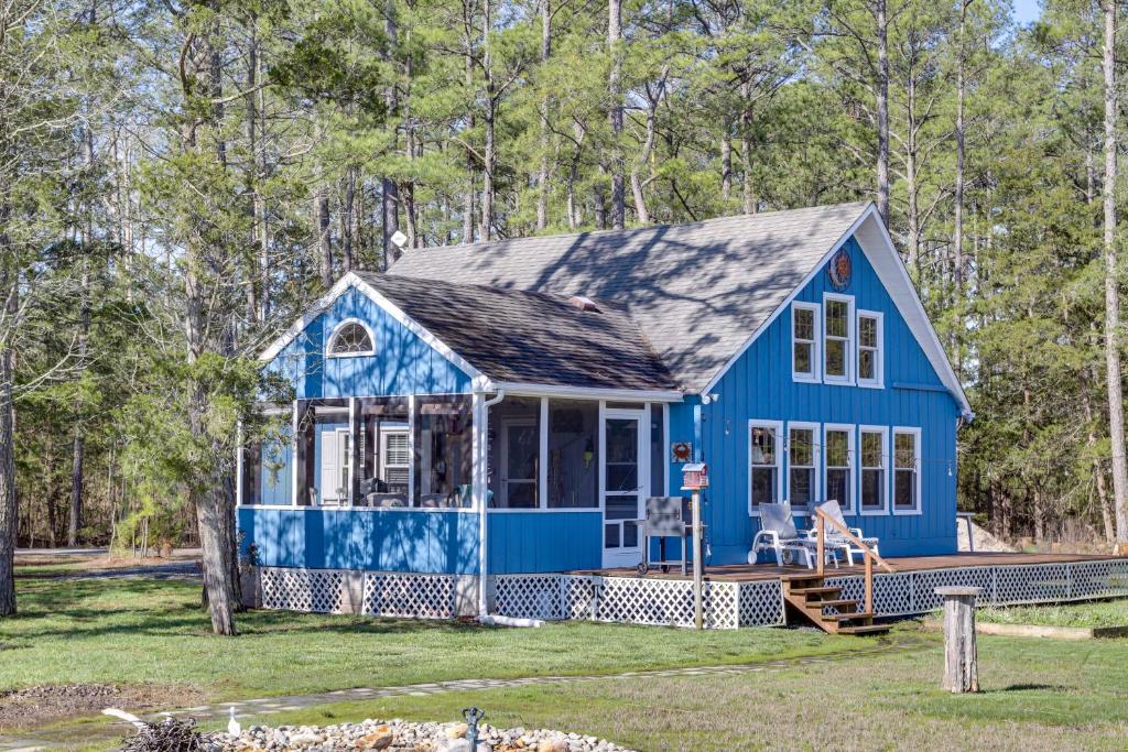 a blue tiny house in the woods at Dog-Friendly Westover Cottage with River Access! in Marion
