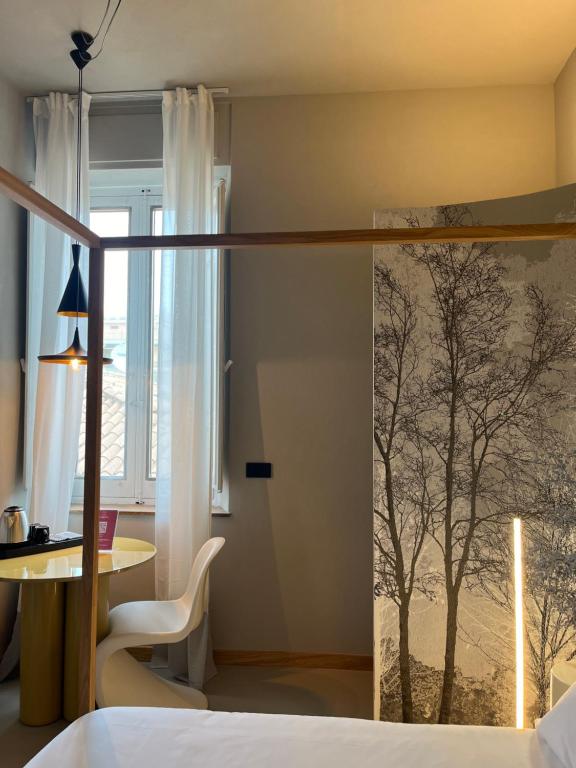 Postel nebo postele na pokoji v ubytování Clemente Rooms