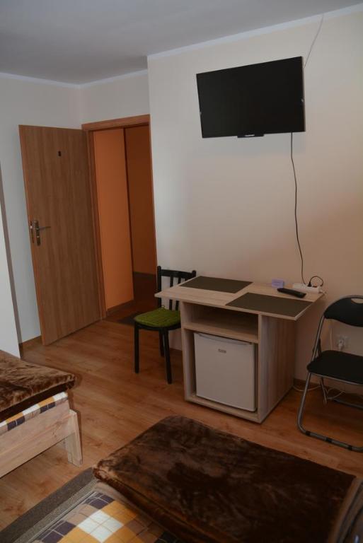 Televízia a/alebo spoločenská miestnosť v ubytovaní Pokoje Gościnne u Agaty