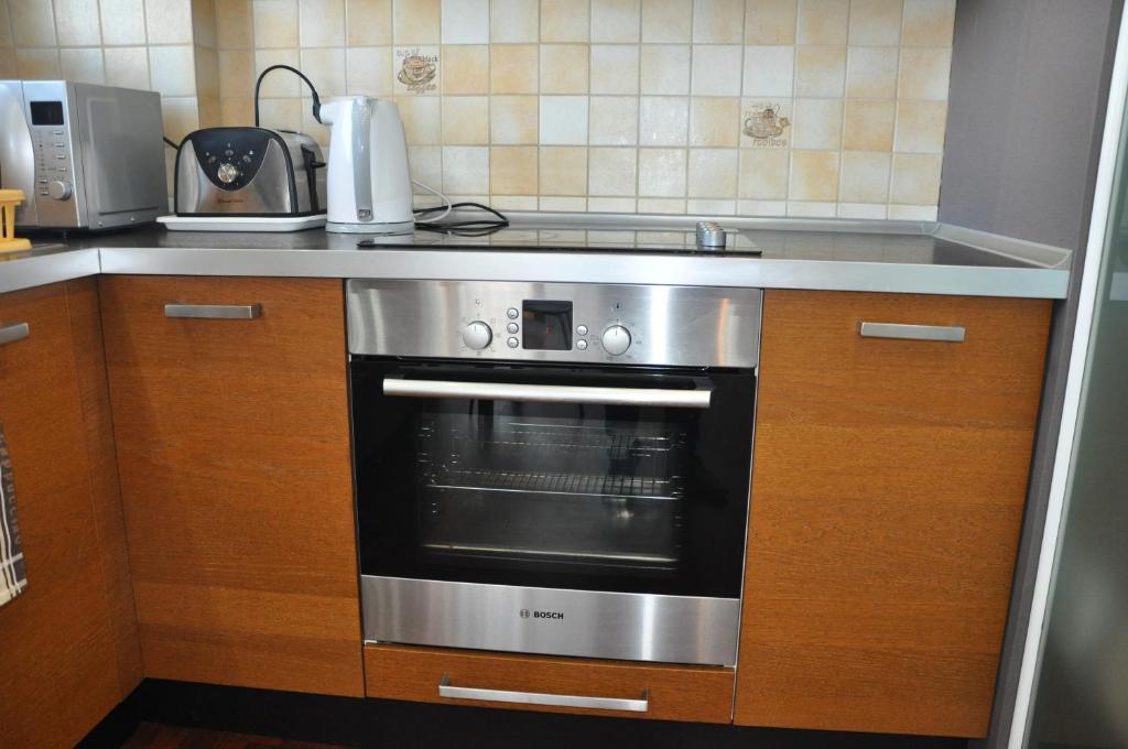 Kuchyňa alebo kuchynka v ubytovaní Apartament Mokotow