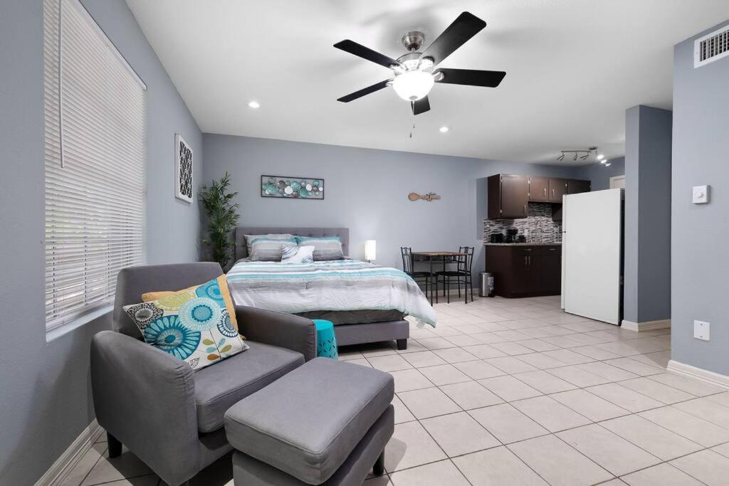 a bedroom with a bed and a ceiling fan at Oak Ridge 5 in McAllen