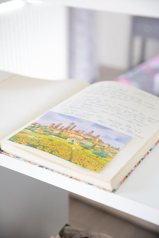 a book sitting on top of a table at Fabio Apartments San Gimignano in San Gimignano