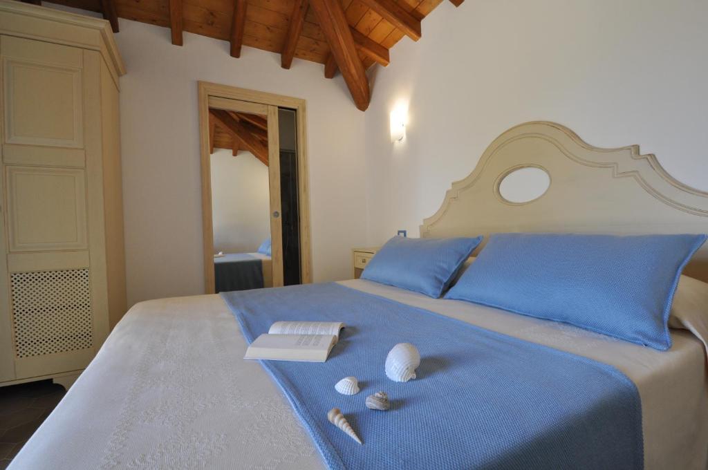 Postel nebo postele na pokoji v ubytování Le Anfore Hotel
