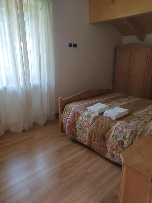 Postel nebo postele na pokoji v ubytování Appartamenti Meoti