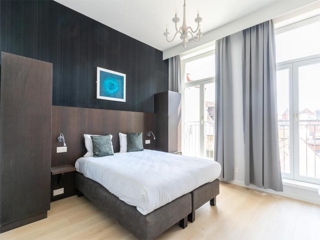 Postel nebo postele na pokoji v ubytování Lace Hotel