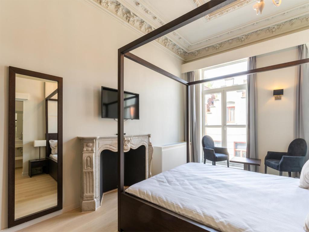TV a/nebo společenská místnost v ubytování Lace Hotel