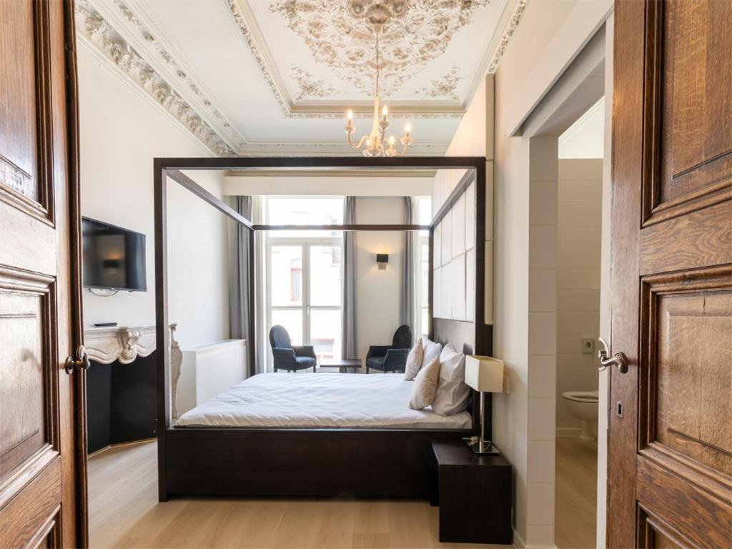 Postel nebo postele na pokoji v ubytování Lace Hotel