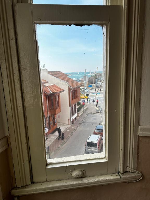 a view of a city street from a window at Apartment in Great Location in Kadıkoy Seaside w. Amazing Shared Terrace in Istanbul