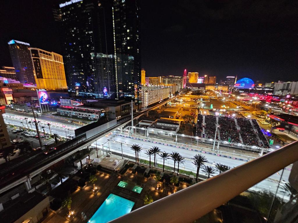 a view of a city at night at Strip view 1 BR suite 2 Full Bath Full Kitchen with Balcony - 900 sqft - MGM Signature in Las Vegas