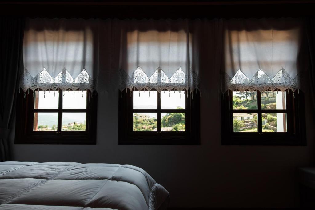 Postel nebo postele na pokoji v ubytování Hotel Pashai