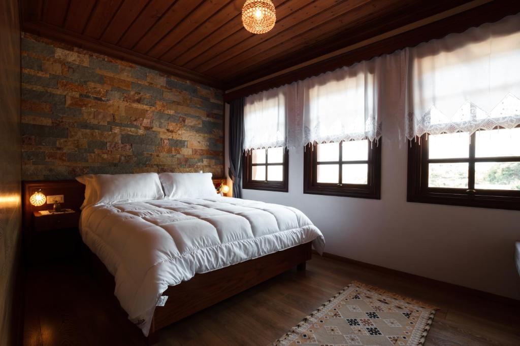 Postel nebo postele na pokoji v ubytování Hotel Pashai