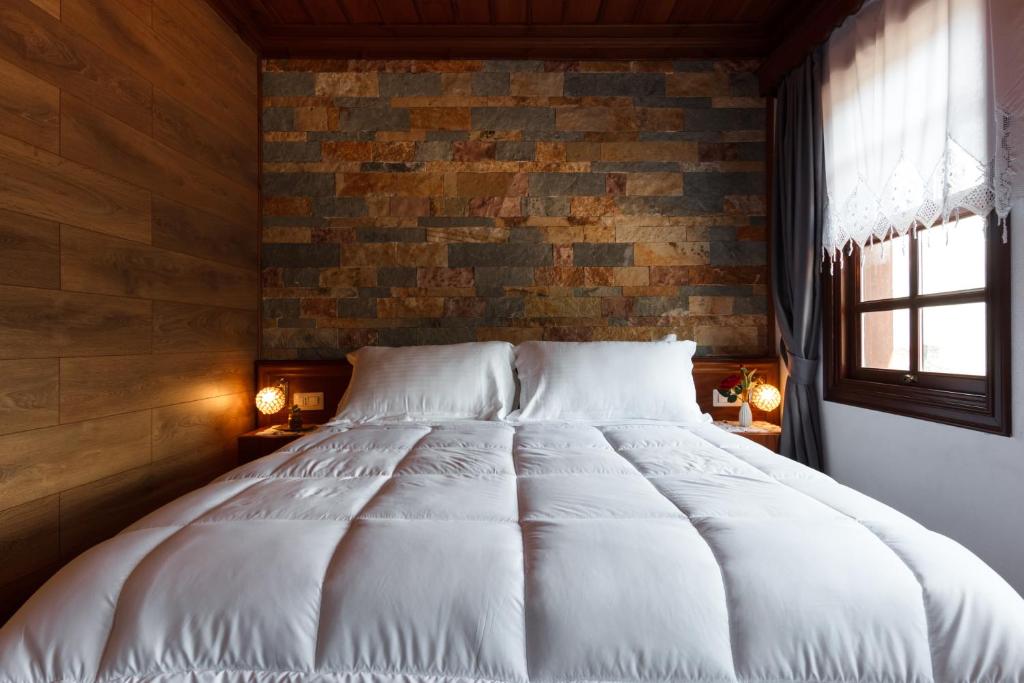 Postel nebo postele na pokoji v ubytování Hotel Pashai