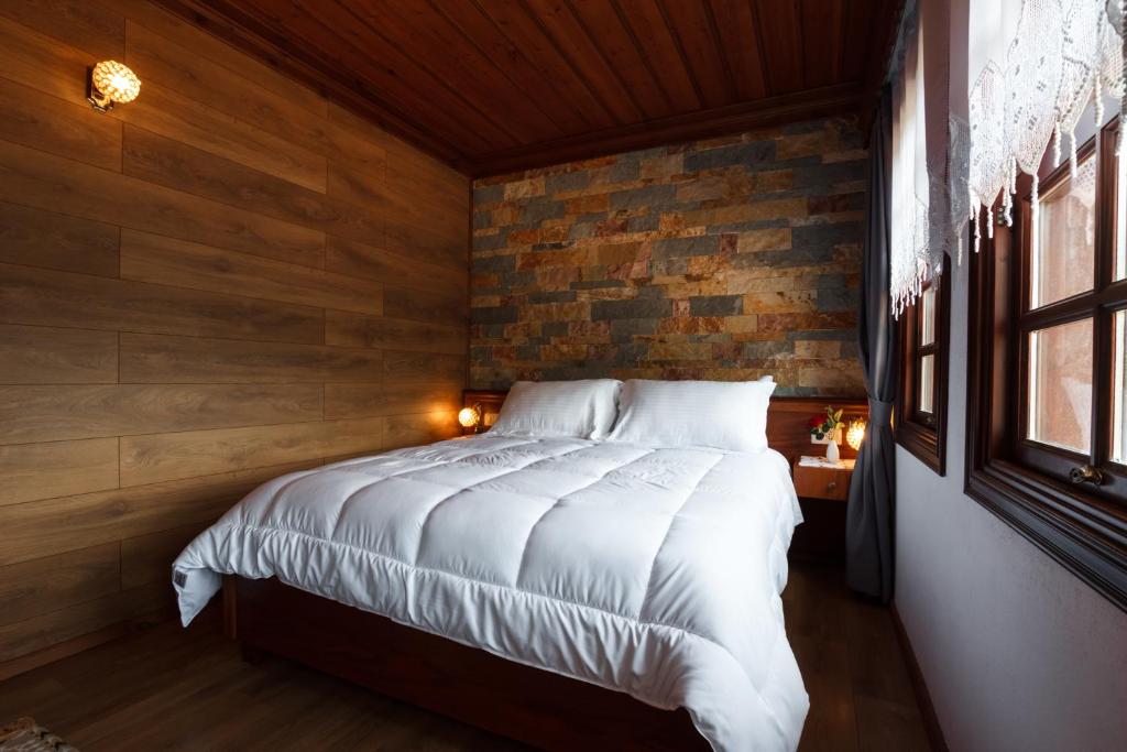 Postel nebo postele na pokoji v ubytování Hotel Pashai
