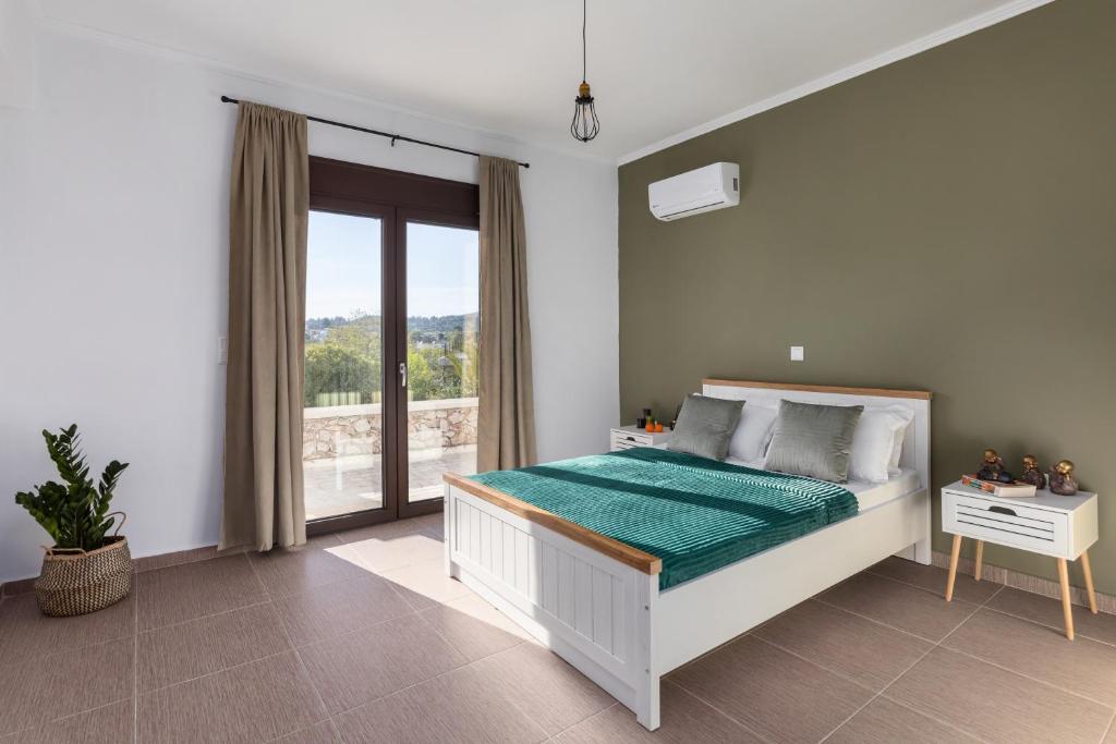 Postel nebo postele na pokoji v ubytování Casa Arches, Rhodes