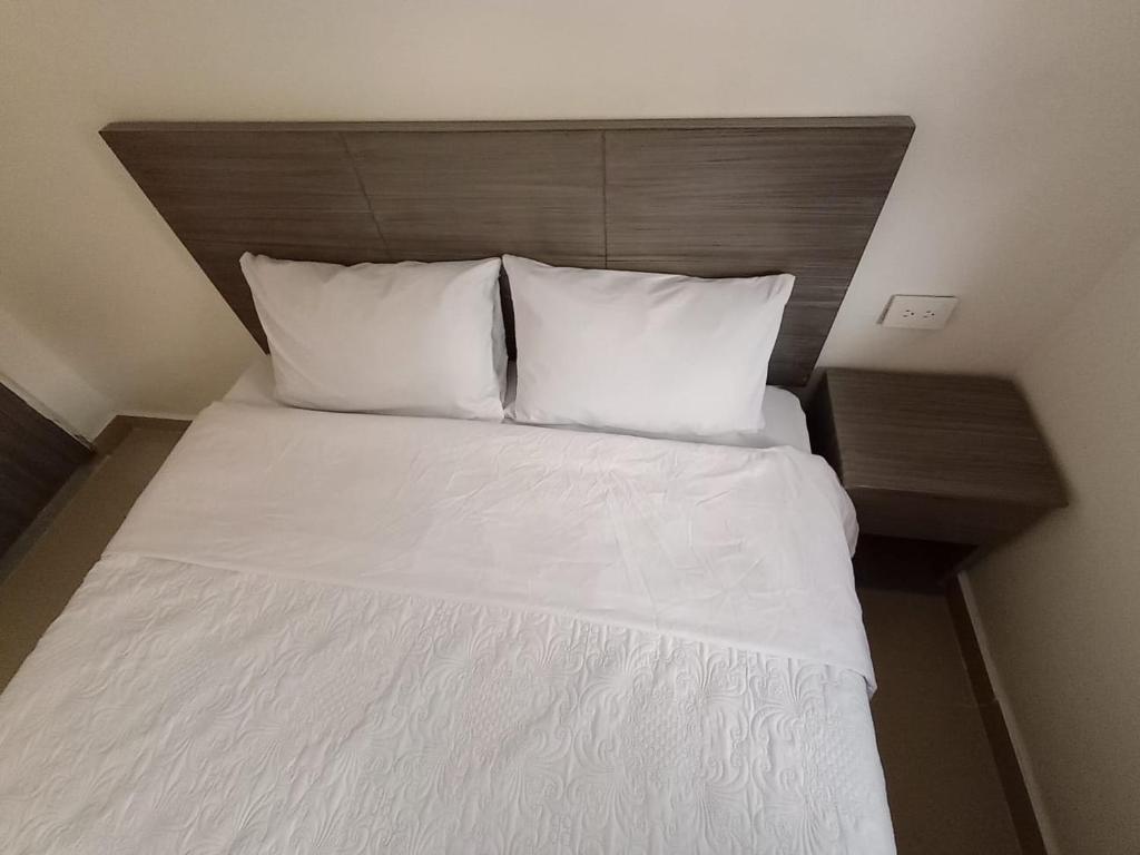 Postel nebo postele na pokoji v ubytování HOSPEDAJE SiLOM