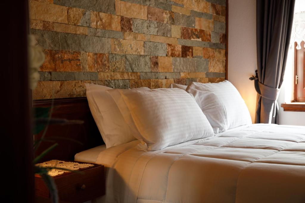 Postel nebo postele na pokoji v ubytování Hotel Pashai