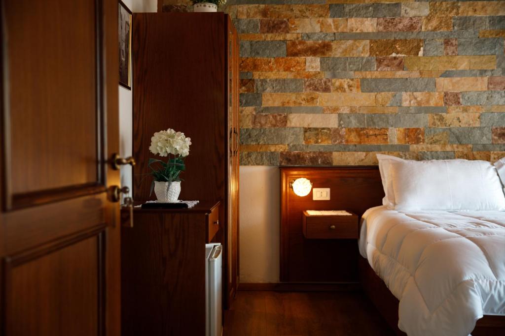 Postel nebo postele na pokoji v ubytování Hotel Pashai