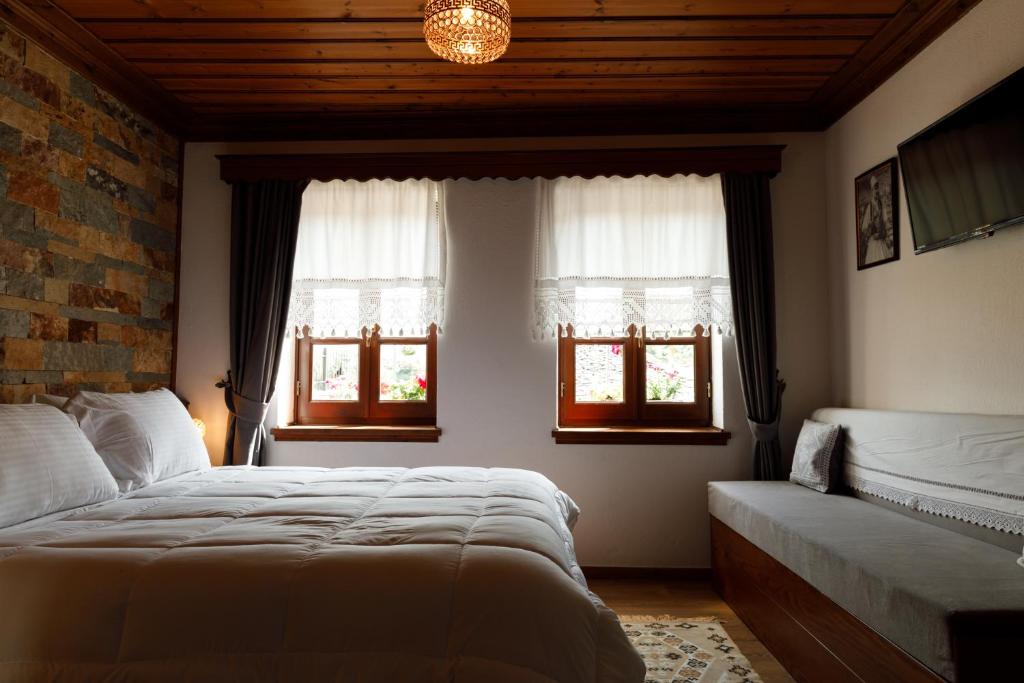 Postel nebo postele na pokoji v ubytování Hotel Pashai