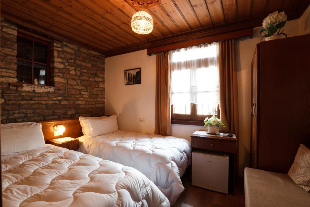 Postel nebo postele na pokoji v ubytování Hotel Pashai