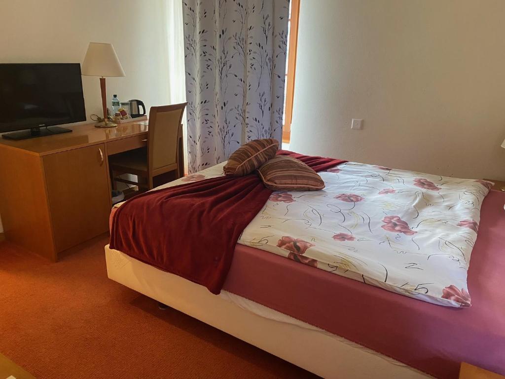 Postel nebo postele na pokoji v ubytování Auberge de Gilly SA