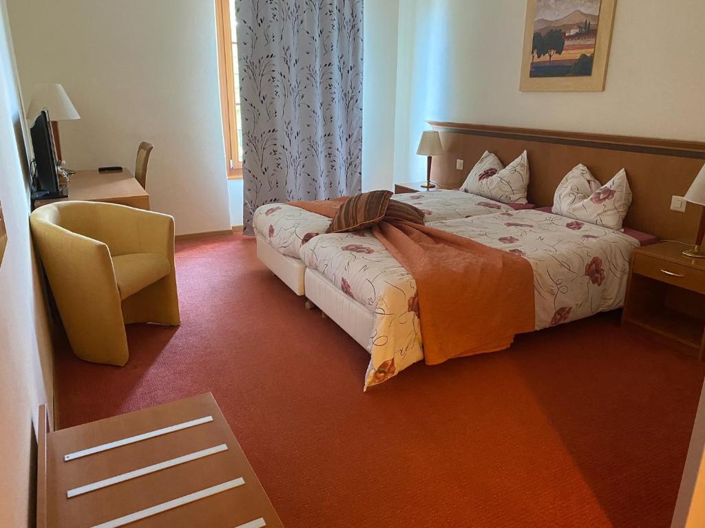 Postel nebo postele na pokoji v ubytování Auberge de Gilly SA