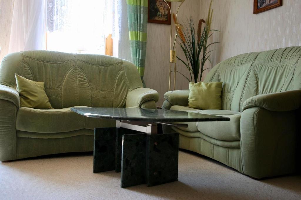 a living room with two couches and a coffee table at Große Wohnung in Weißenstadt in Weißenstadt