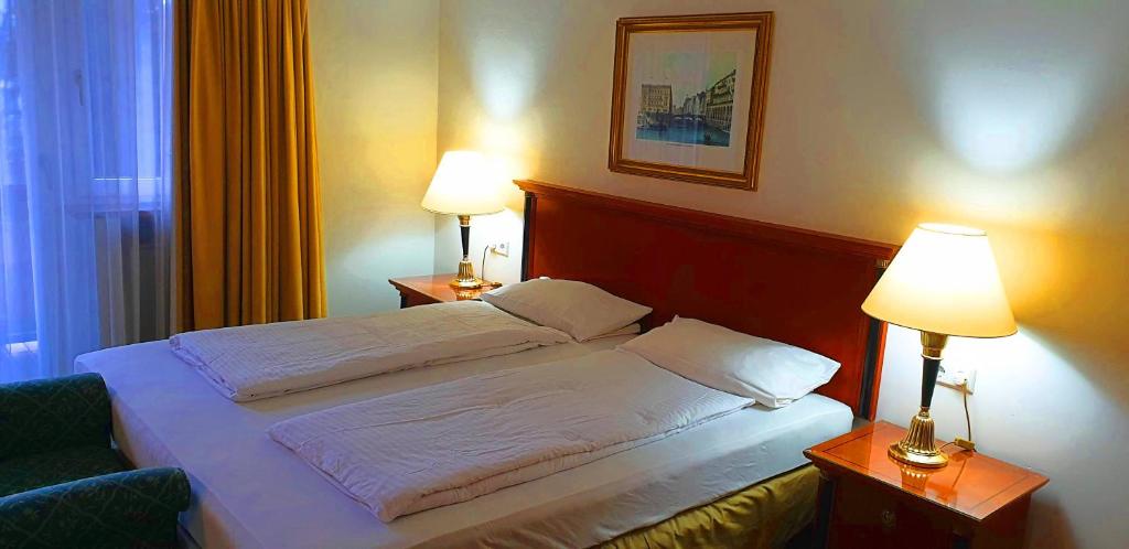 Postel nebo postele na pokoji v ubytování Alpenhotel Gastager
