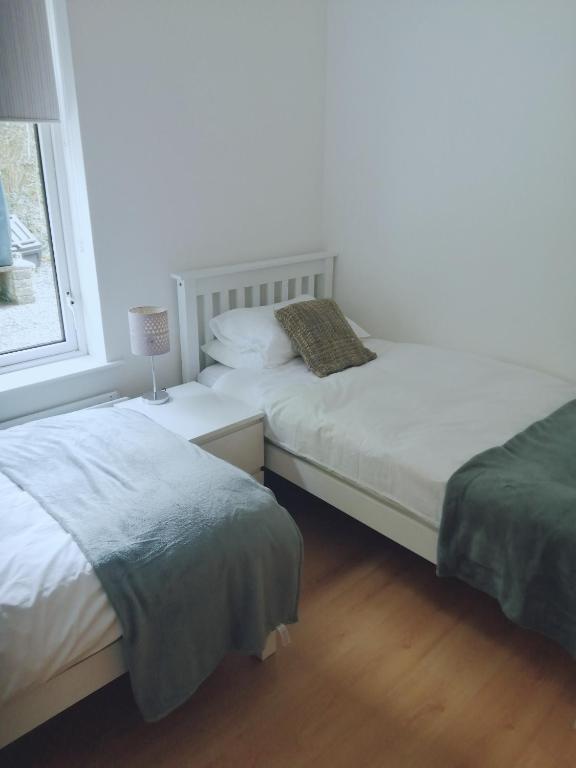 Postel nebo postele na pokoji v ubytování Carolina Cottage