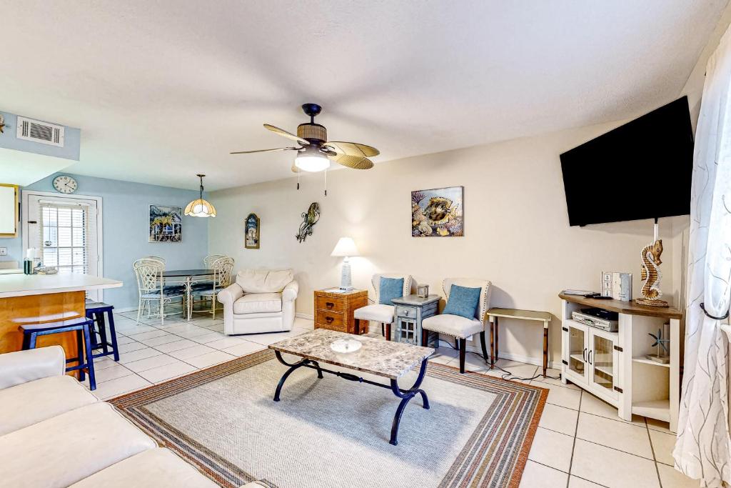 a living room with a couch and a table at Gulf Highlands 115 Cindy Lane in Panama City Beach