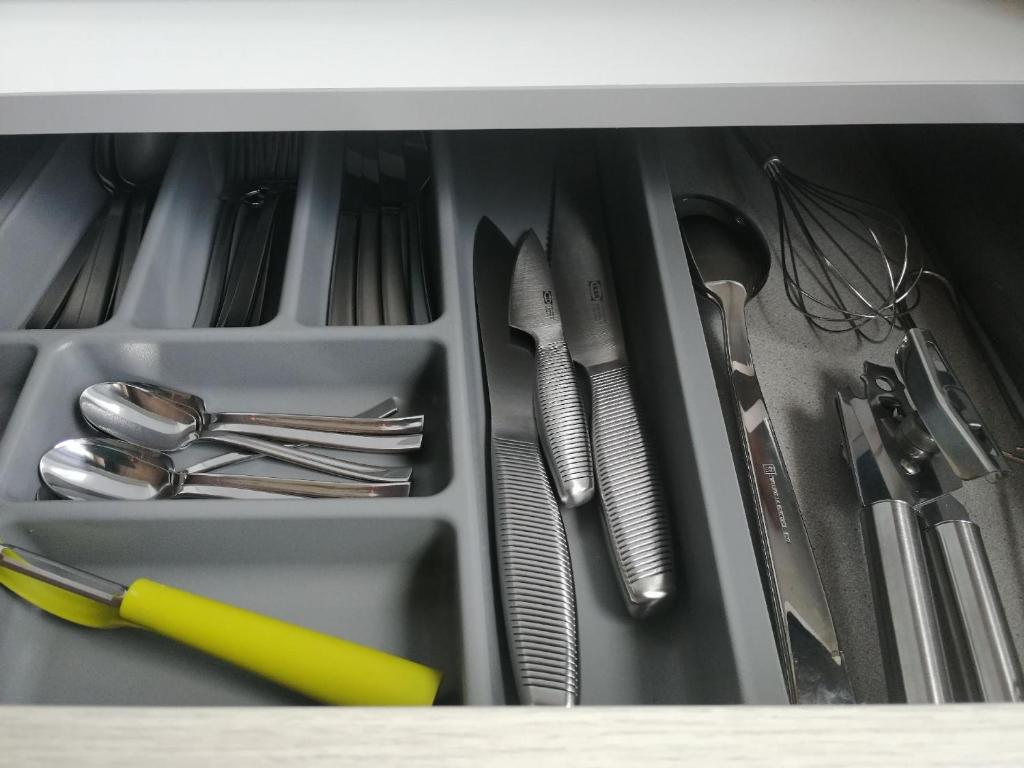 a drawer filled with utensils and utensils sidx sidx sidx sidx sidx at Schönes Appartement in Zierzow mit Grill, Terrasse und Garten in Sietow