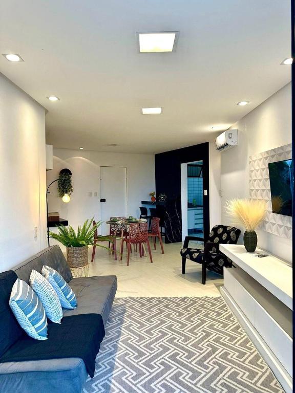 a living room with a couch and a dining room at (216) Clean Beach - Near The Beach in Pimenta