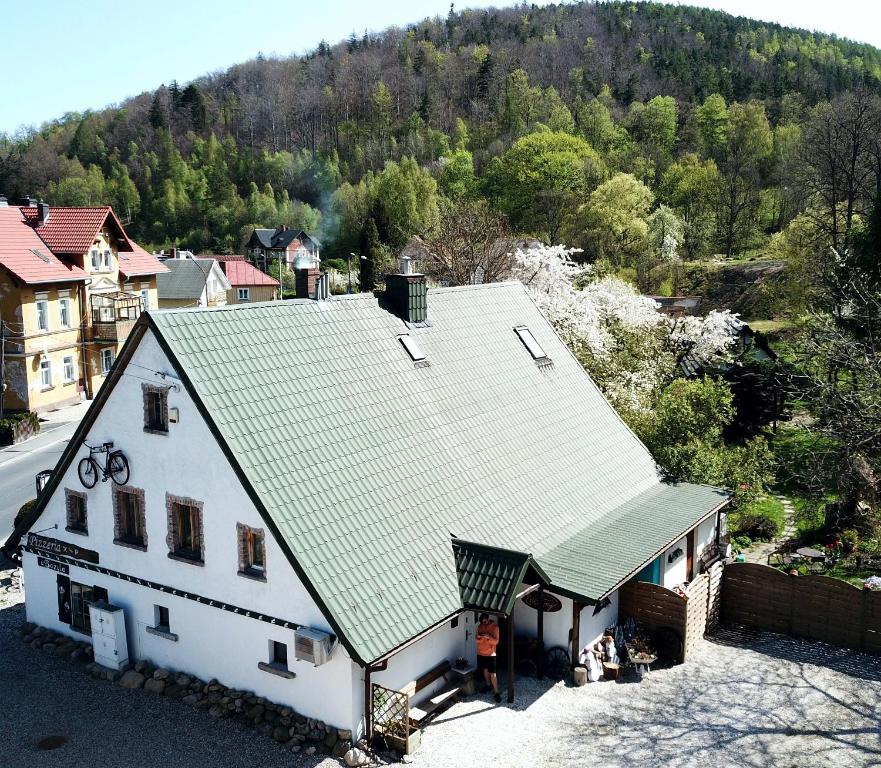 an overhead view of a house with a green roof at Górski Sad - u Bazyla in Piechowice